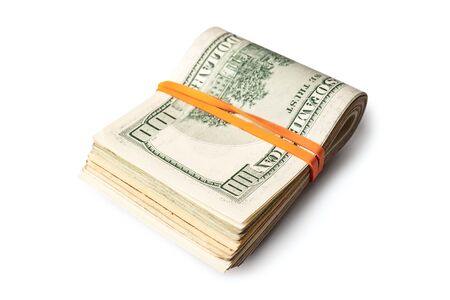 Dollar banknotes rolled into a roll on a white backgroundの写真素材