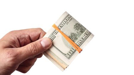 Dollar banknote kept in male hand on white backgroundの写真素材