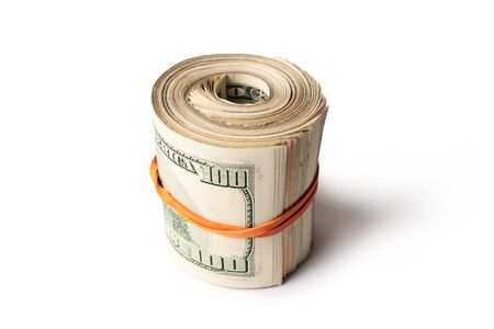 Dollar banknotes rolled into a roll on a white backgroundの写真素材