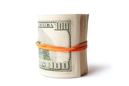 Dollar banknotes rolled into a roll on a white backgroundの写真素材