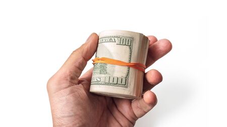 Dollar banknote kept in male hand on white backgroundの写真素材