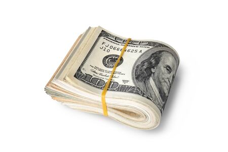 Dollar banknotes rolled into a roll on a white backgroundの写真素材