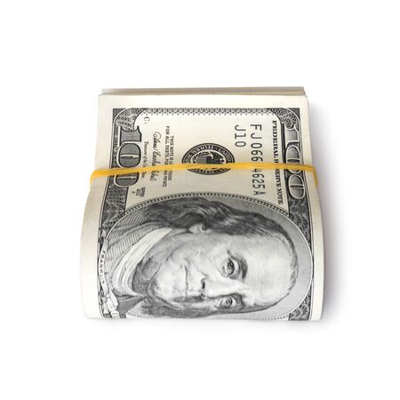 Dollar banknotes rolled into a roll on a white backgroundの写真素材