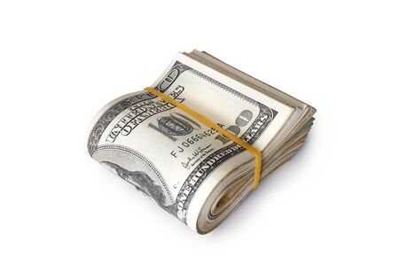 Dollar banknotes rolled into a roll on a white backgroundの写真素材