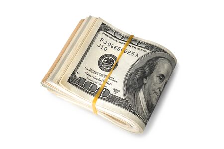 Dollar banknotes rolled into a roll on a white backgroundの写真素材