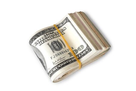 Dollar banknotes rolled into a roll on a white backgroundの写真素材