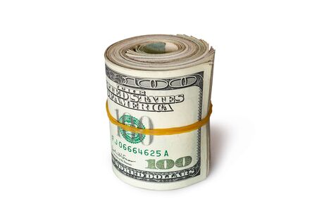Dollar banknotes rolled into a roll on a white backgroundの写真素材