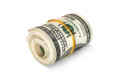 Dollar banknotes rolled into a roll on a white backgroundの写真素材