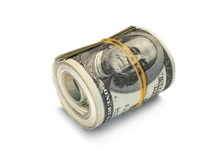 Dollar banknotes rolled into a roll on a white backgroundの写真素材