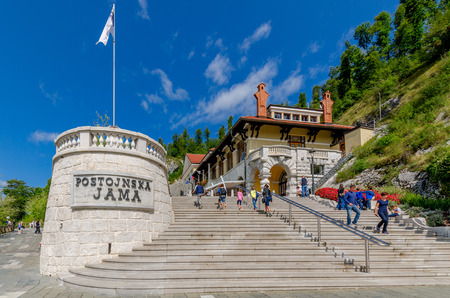 Postojna, Notranjska, Slovenia - August 22, 2017: Jamski Dvorec mansion - entrance to the Postojna Cave.のeditorial素材