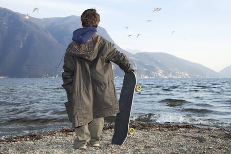 Six year old boy with skateboardの写真素材