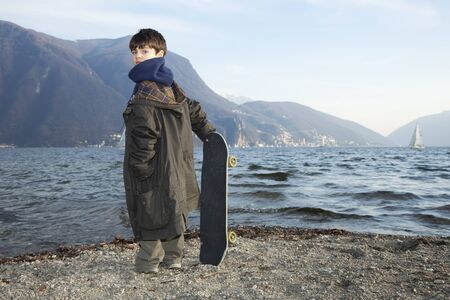 Six year old boy with skateboardの写真素材