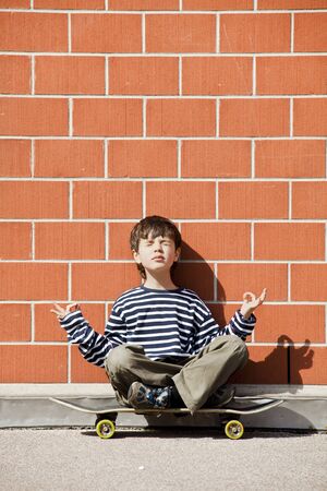Six year old boy with skateboardの写真素材