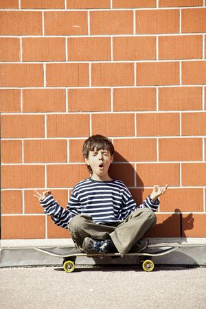 Six year old boy with skateboardの写真素材