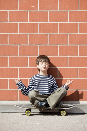 Six year old boy with skateboardの写真素材