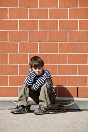 Six year old boy with skateboardの写真素材