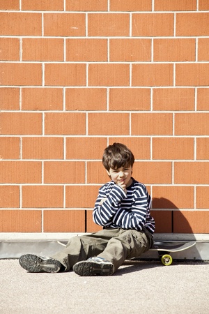 Six year old boy with skateboardの写真素材