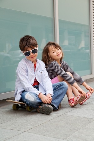 Portrait of a girl and a boy outdoorsの写真素材