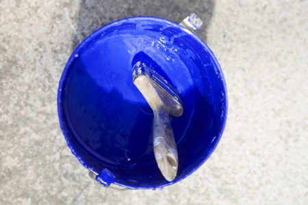 brush dipped in blue paintの写真素材