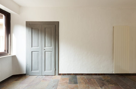 closed door in a rustic house, stone floor