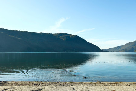 Landscape with lake and mountain in southern Ticinoの写真素材