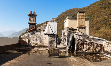 roof of an old building, exterior, chimneyの写真素材