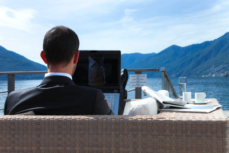 one businessman are relax in front of the lakeの写真素材