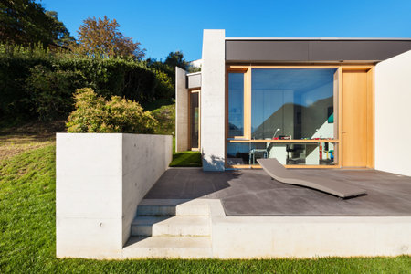 beautiful modern house in cement, view from the gardenの写真素材