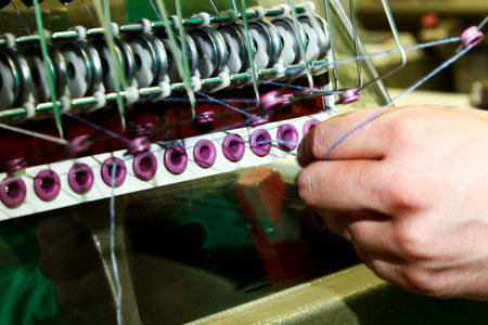 Industrial textile factory, man at work, detail