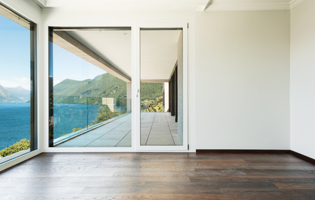 beautiful modern house, empty room with window overlooking the lakeの写真素材