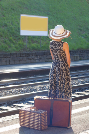 Woman waiting at the railway stationの写真素材