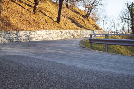 Paved country road in autumnの写真素材