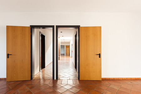 Architecture, interior, empty room with two doors, terracotta floorの写真素材