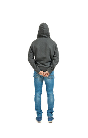 Portrait of the young man isolated on a white background, back viewの写真素材