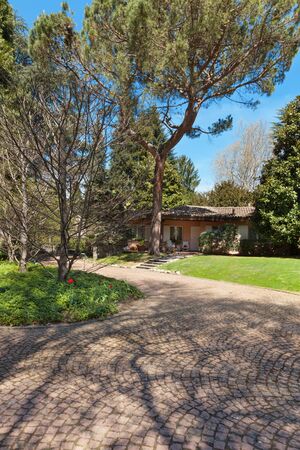 park of a villa, view from the pathway, outdoorsの写真素材