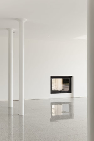modern house, empty room with pillar and fireplace, white wallsの写真素材