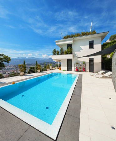 beautiful white house with swimming pool, summer dayの写真素材
