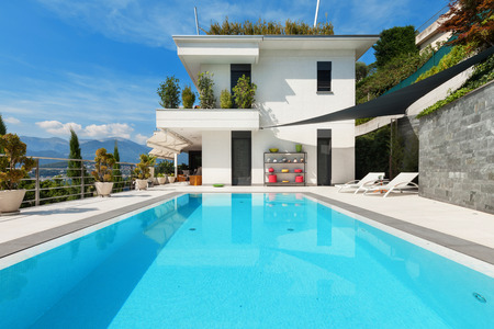 beautiful white house with swimming pool, summer dayの写真素材