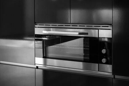 Detail of oven of domestic kitchen closedの写真素材