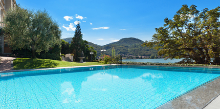 external of a villa, beautiful swimming pool overlooking the lakeの写真素材