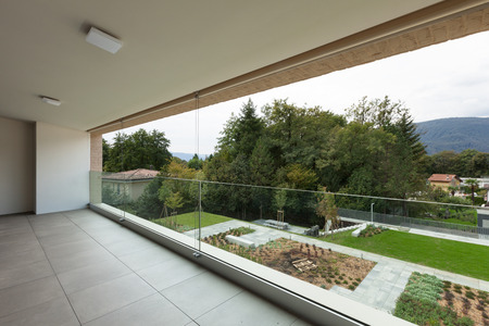 Architecture, new apartment, wide balcony with garden viewの写真素材