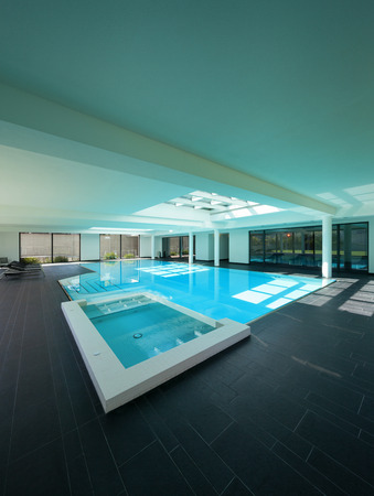 indoor swimming pool of a modern house with spaの写真素材
