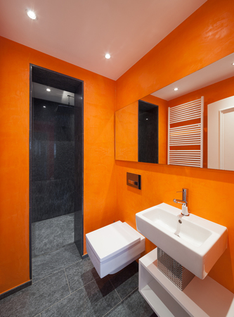 Interior of house, modern bathroom, orange wallsの写真素材
