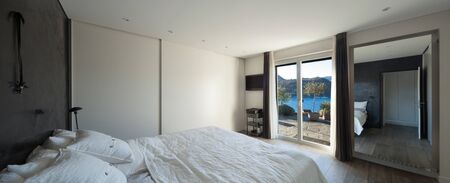 Interior of house, comfortable bedroom, view from the bedの写真素材