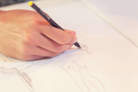 Female hand drawn on white paperの写真素材