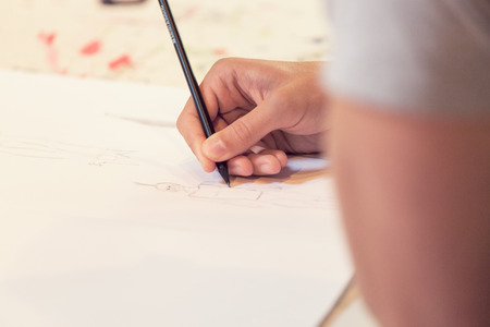 Female hand drawn on white paperの写真素材