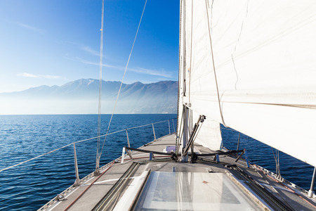 Sailing boat in sunny day in the lakeの写真素材