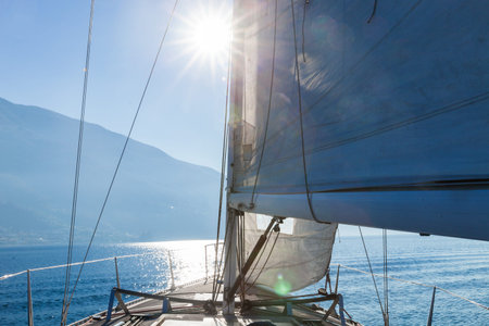 Sailing boat in sunny day in the lake, lonely
