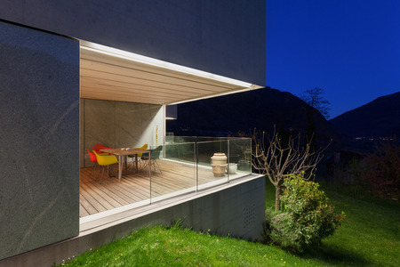 Architecture modern design, concrete house, lit terrace at nightの写真素材