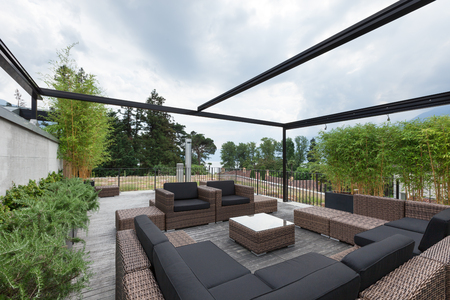 View of a modern patio with comfortable garden furnitureの写真素材